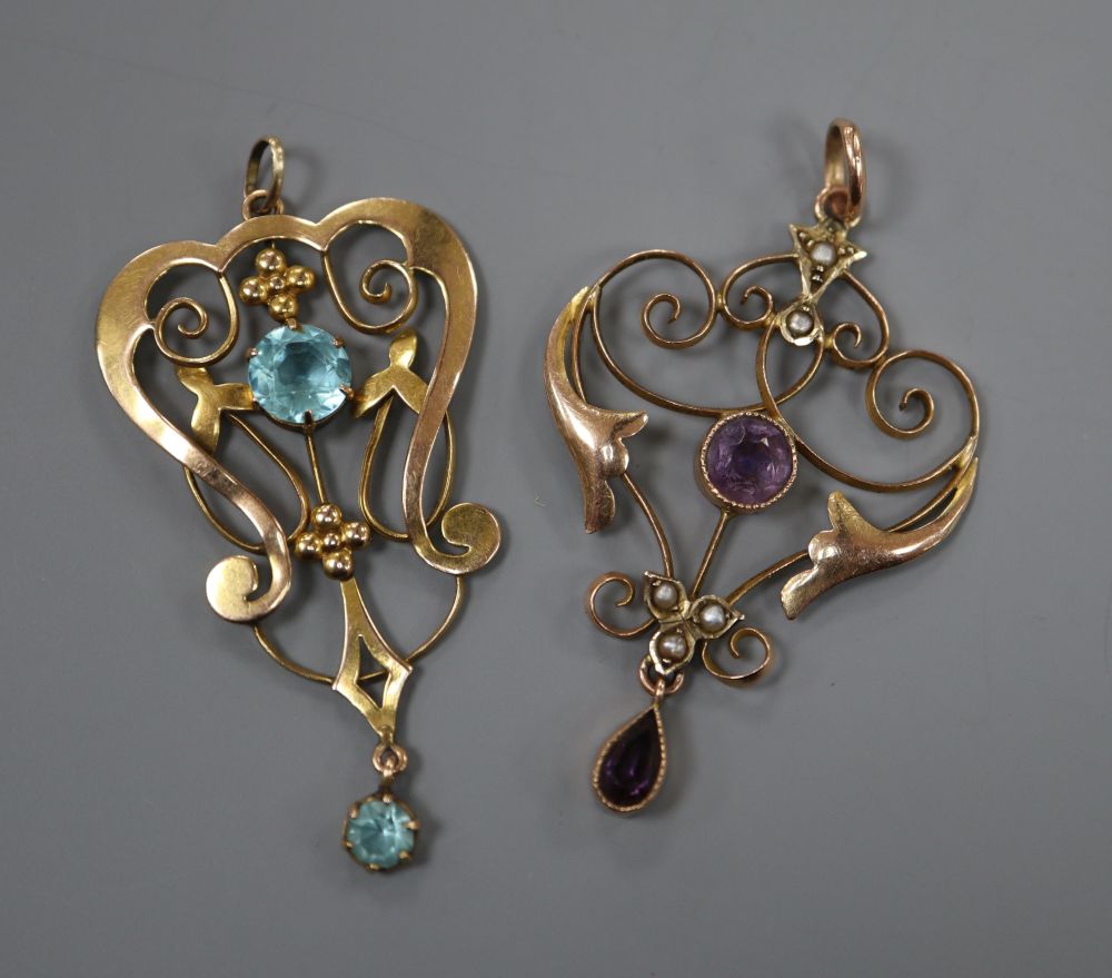 Two early 20th century 9ct and gem set drop pendants, largest 41mm, gross 4 grams.